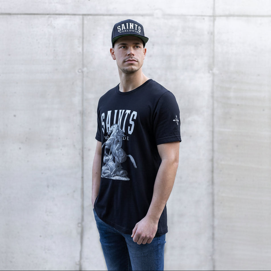 Man wearing Saints Worldwide black T-Shirt
