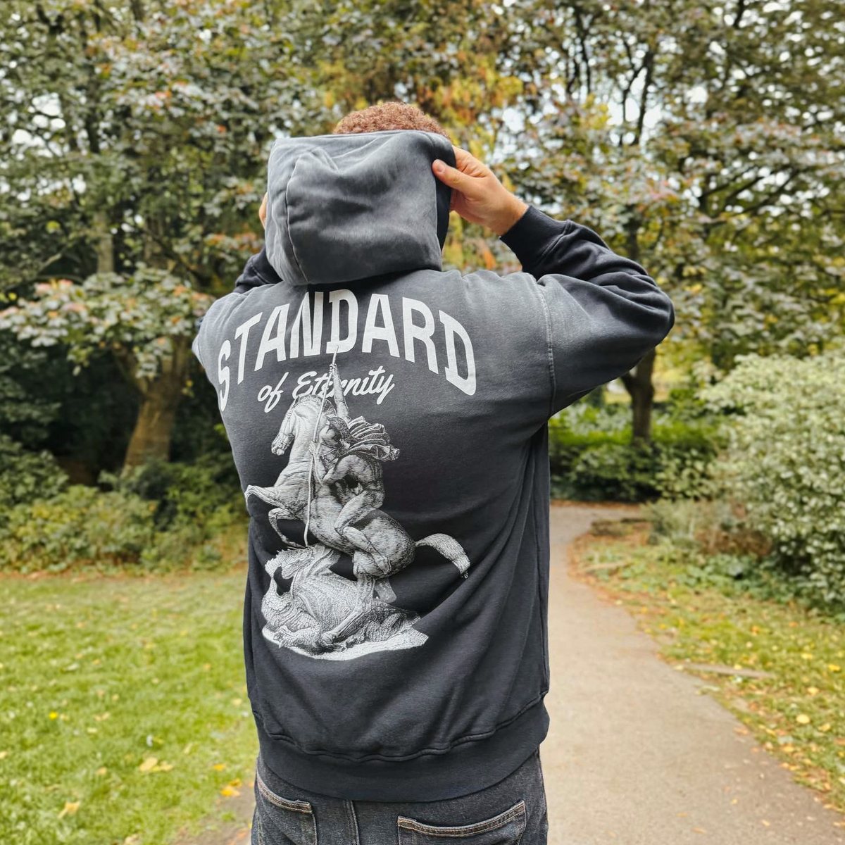 Back of the STANDARD Hoodie in washed black: STANDARD of Eternity above St George defeating the dragon
