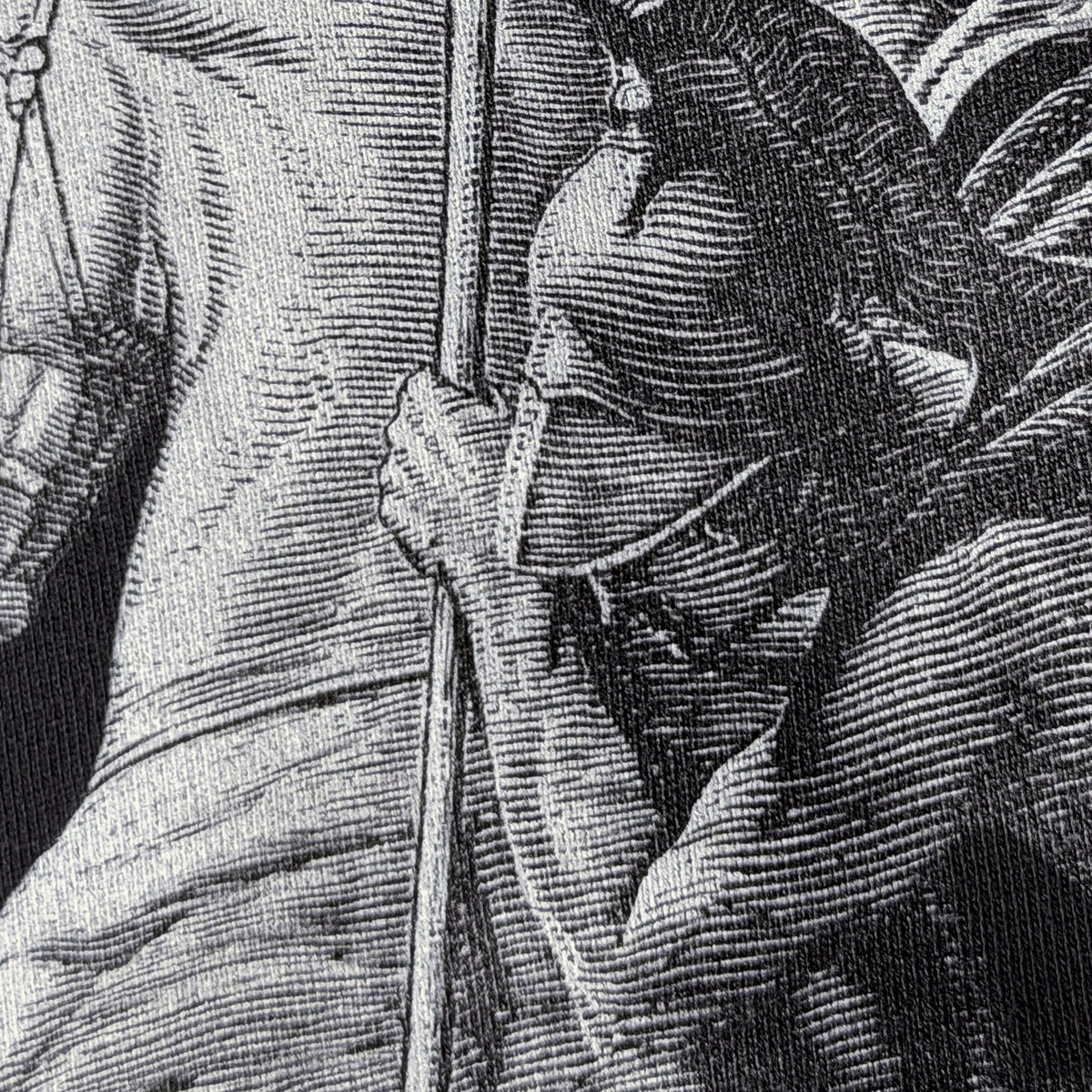 Close-up of the St George engraving on the back of the STANDARD Hoodie, showing the fine line detail
