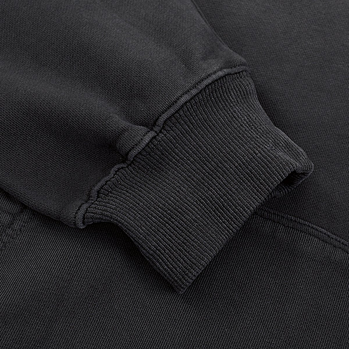Close-up of the ribbed cuff on the STANDARD Hoodie in washed black