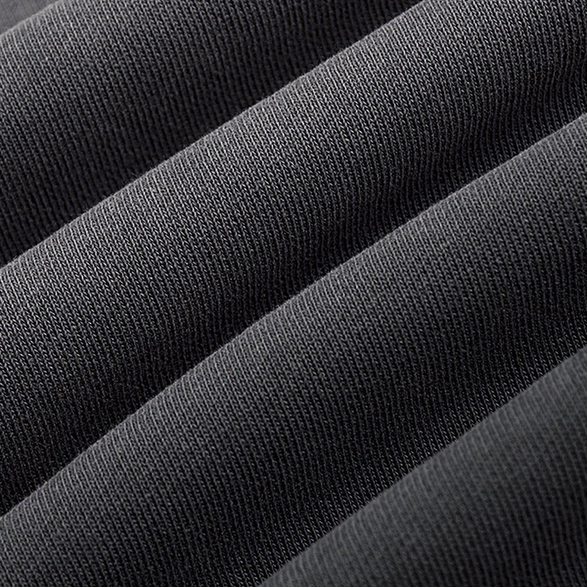 Close-up of the heavyweight cotton on the STANDARD Hoodie in washed black